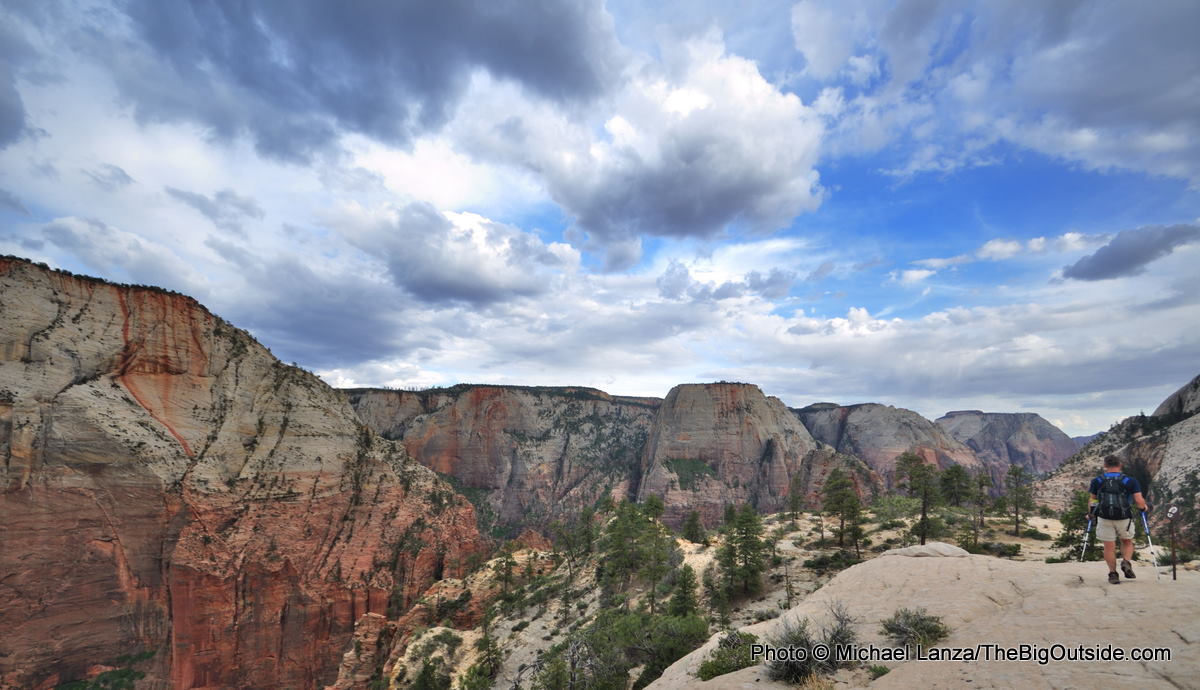 A hiker on the West Rim Trail above Zion Canyon in Zion National Park.