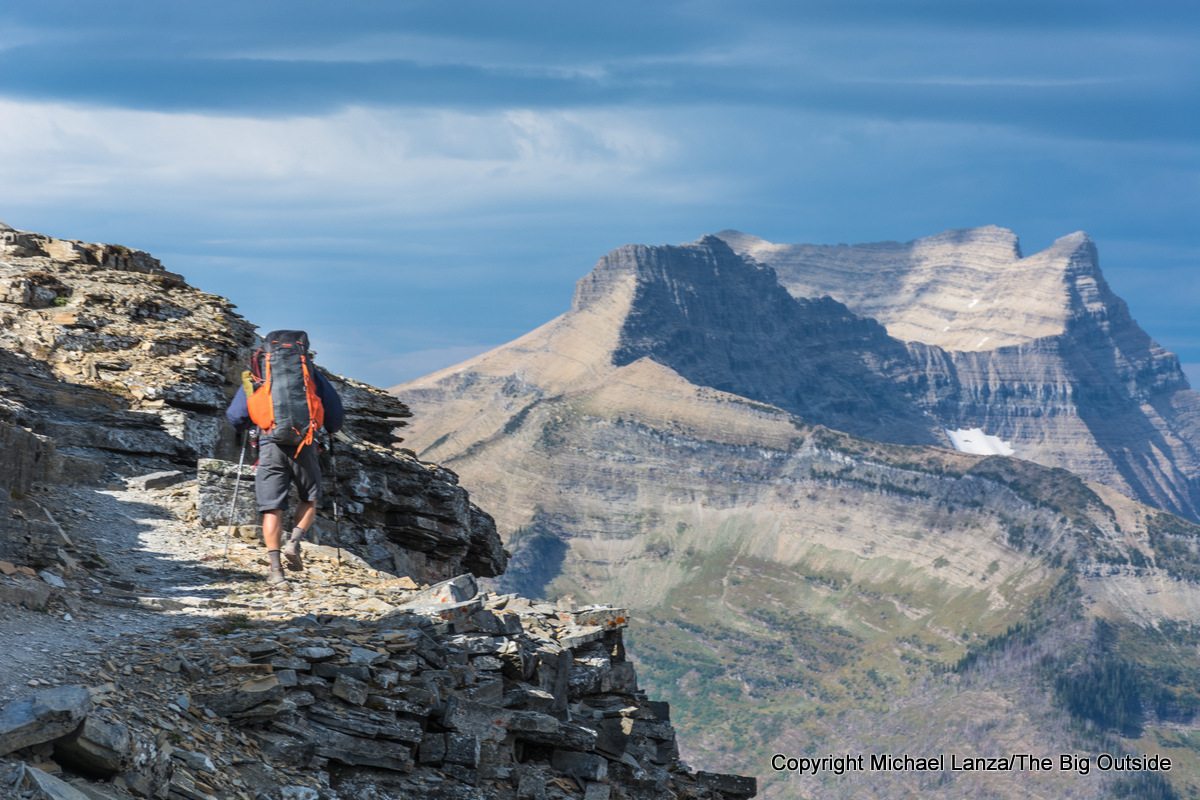 A backpacker on the Dawson Pass Trail in Glacier National Park.