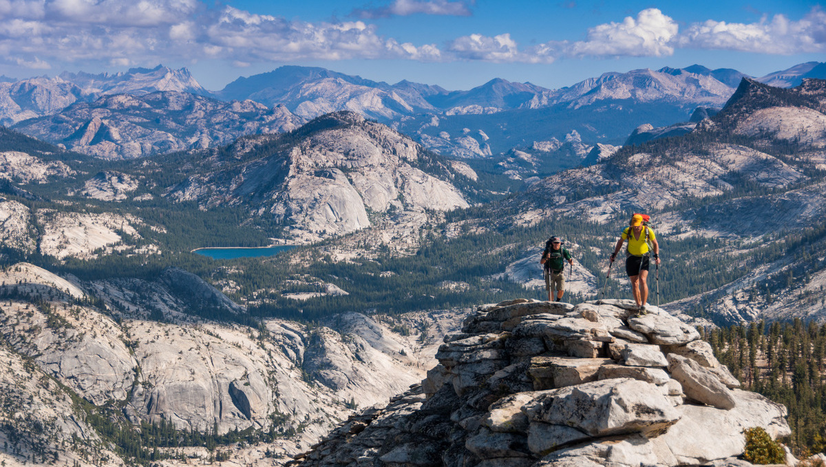 Backpackers hiking over Clouds Rest in Yosemite National Park.