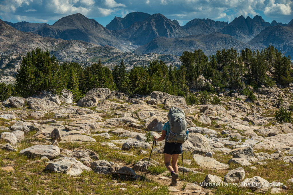 A backpacker hiking the Doubletop Mountain Trail, Wind River Range, Wyoming. A backpacker hiking the Doubletop Mountain Trail, Wind River Range, Wyoming.