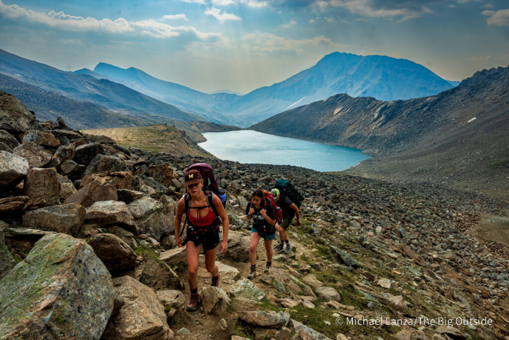 Backpackers hiking above Curator Lake toward the Notch, along the Skyline Trail in Jasper National Park. Backpackers hiking above Curator Lake toward the Notch, along the Skyline Trail in Jasper National Park.
