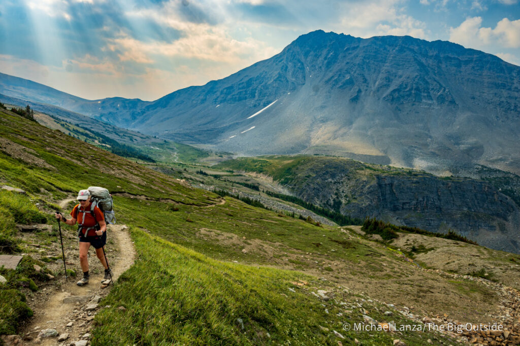 A backpacker hiking above Curator camp along the Skyline Trail in Jasper National Park. A backpacker hiking above Curator camp along the Skyline Trail in Jasper National Park.
