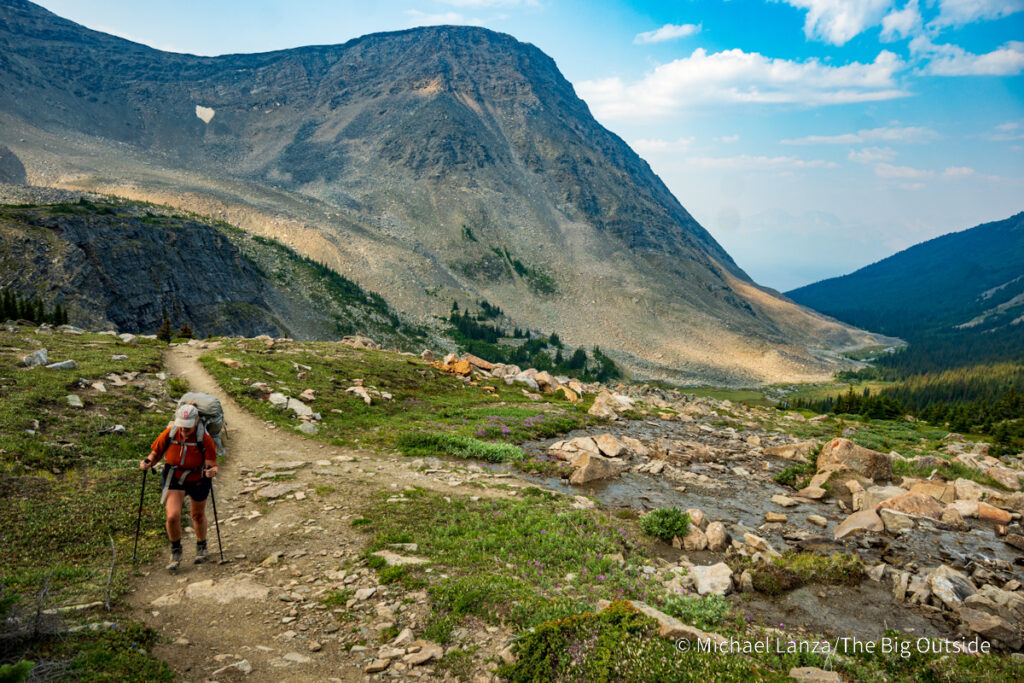 A backpacker hiking above Curator camp along the Skyline Trail in Jasper National Park. A backpacker hiking above Curator camp along the Skyline Trail in Jasper National Park.