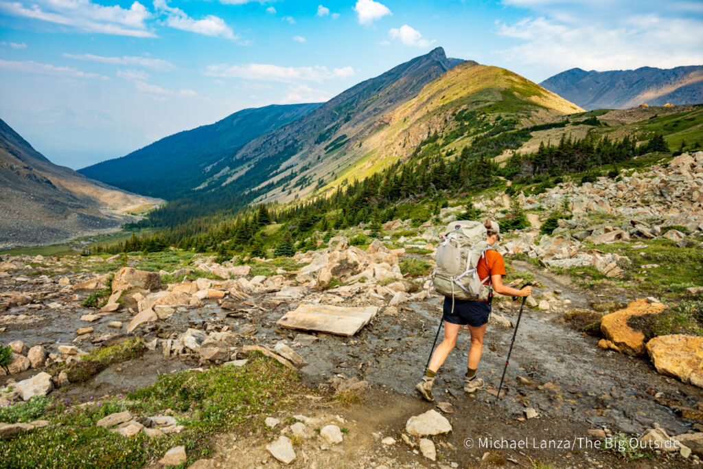 A backpacker hiking above Curator camp along the Skyline Trail in Jasper National Park. A backpacker hiking above Curator camp along the Skyline Trail in Jasper National Park.
