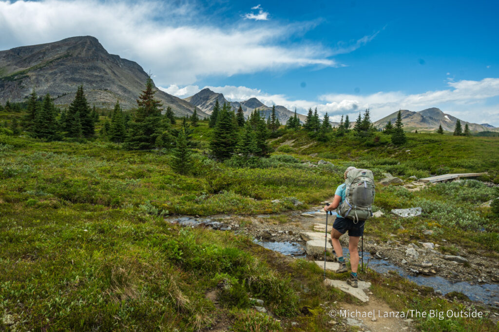 A backpacker hiking the Skyline Trail north to Curator camp in Jasper National Park. A backpacker hiking the Skyline Trail north to Curator camp in Jasper National Park.
