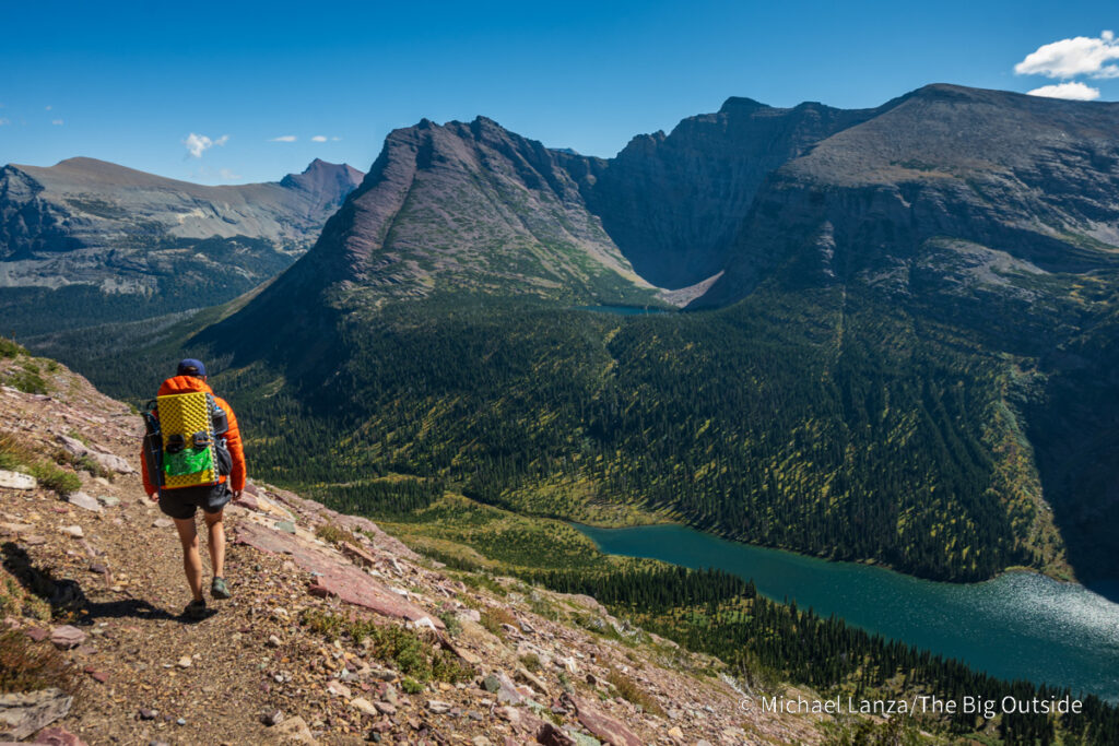 A backpacker hikng the Continental Divide Trail south of Triple Divide Pass in Glacier National Park. A backpacker hikng the Continental Divide Trail south of Triple Divide Pass in Glacier National Park.