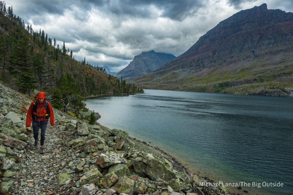 A backpacker hiking above St. Mary Lake in Glacier National Park. A backpacker hiking above St. Mary Lake in Glacier National Park.