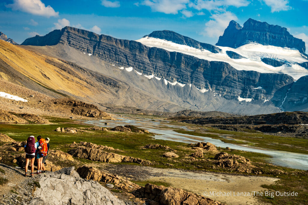 Backpackers hiking up the Brazeau River Valley toward Cataract Pass in Jasper National Park, Canadian Rockies. Backpackers hiking up the Brazeau River Valley toward Cataract Pass in Jasper National Park, Canadian Rockies.