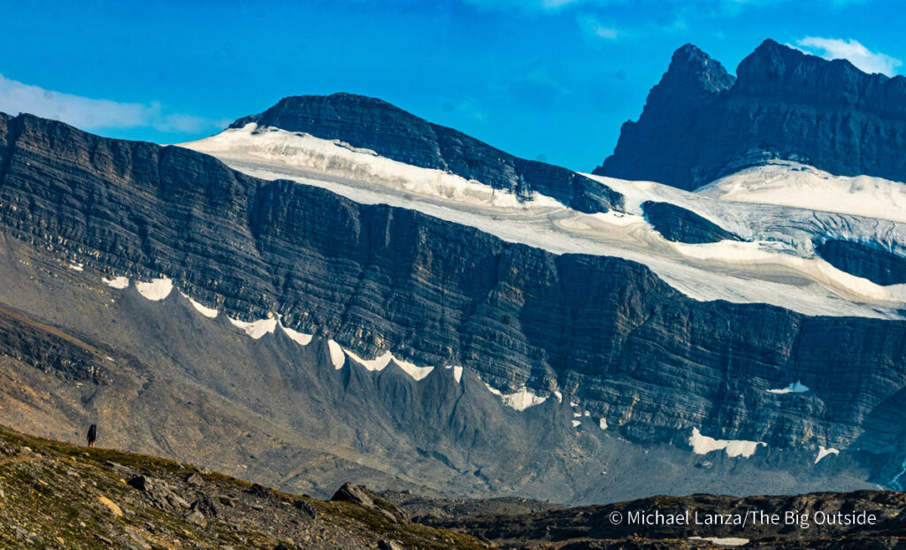 A backpacker hiking the Nigel, Cataract, and Cline Passes Route in the upper Brazeau River Valley in Jasper National Park, Canadian Rockies. A backpacker hiking the Nigel, Cataract, and Cline Passes Route in the upper Brazeau River Valley in Jasper National Park, Canadian Rockies.