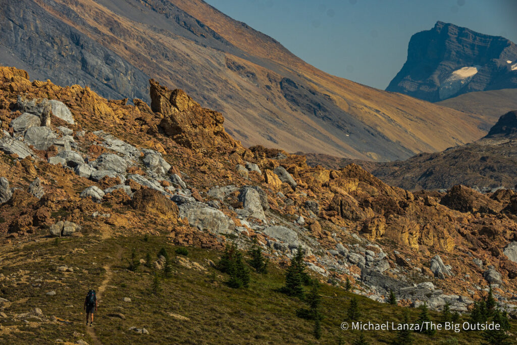 A backpacker hiking the Nigel, Cataract, and Cline Passes Route in the upper Brazeau River Valley in Jasper National Park, Canadian Rockies. A backpacker hiking the Nigel, Cataract, and Cline Passes Route in the upper Brazeau River Valley in Jasper National Park, Canadian Rockies.