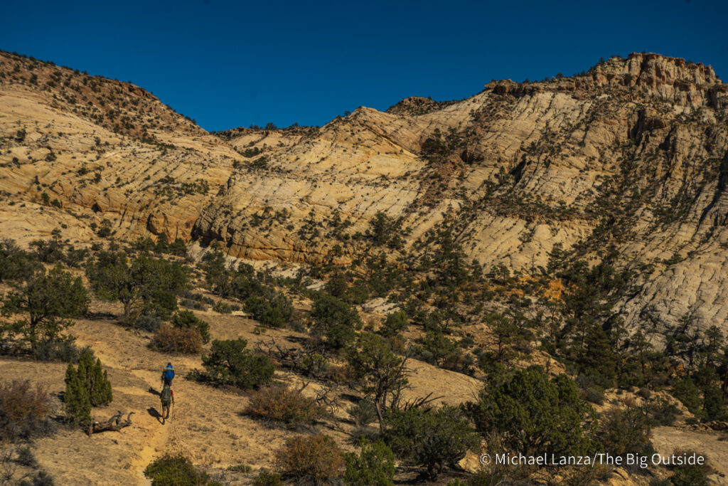 Backpackers on the Boulder Mail Trail in Utah's Grand Staircase-Escalante National Monument. Backpackers on the Boulder Mail Trail in Utah's Grand Staircase-Escalante National Monument.