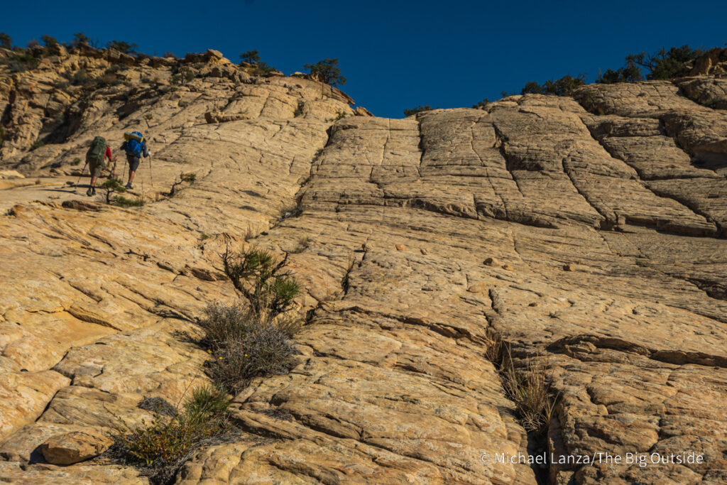 Backpackers on the Boulder Mail Trail in Utah's Grand Staircase-Escalante National Monument. Backpackers on the Boulder Mail Trail in Utah's Grand Staircase-Escalante National Monument.