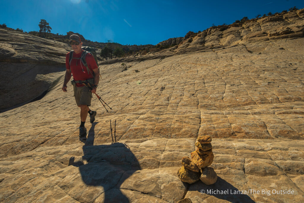 A backpacker hiking the Boulder Mail Trail in Utah's Grand Staircase-Escalante National Monument. A backpacker hiking the Boulder Mail Trail in Utah's Grand Staircase-Escalante National Monument.