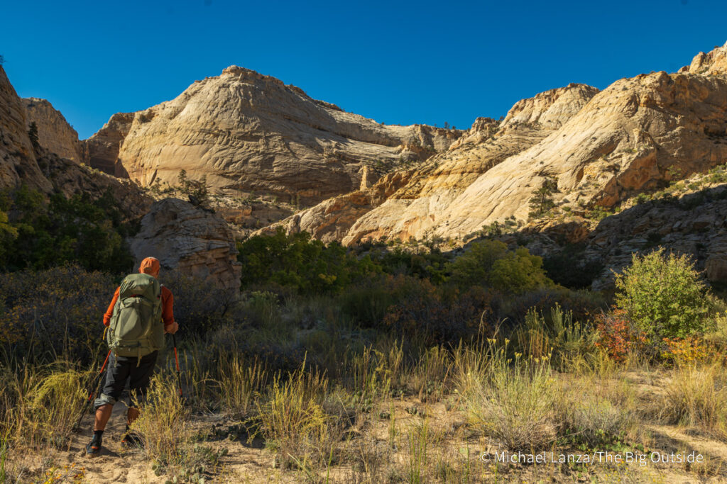 A backpacker hiking down Death Hollow in southern Utah's Grand Staircase-Escalante National Monument. A backpacker hiking down Death Hollow in southern Utah's Grand Staircase-Escalante National Monument.