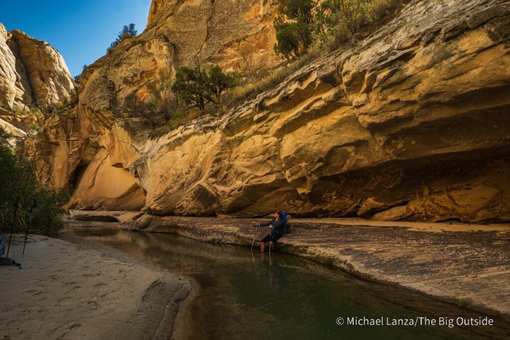 A backpacker in Death Hollow in southern Utah's Grand Staircase-Escalante National Monument. A backpacker in Death Hollow in southern Utah's Grand Staircase-Escalante National Monument.