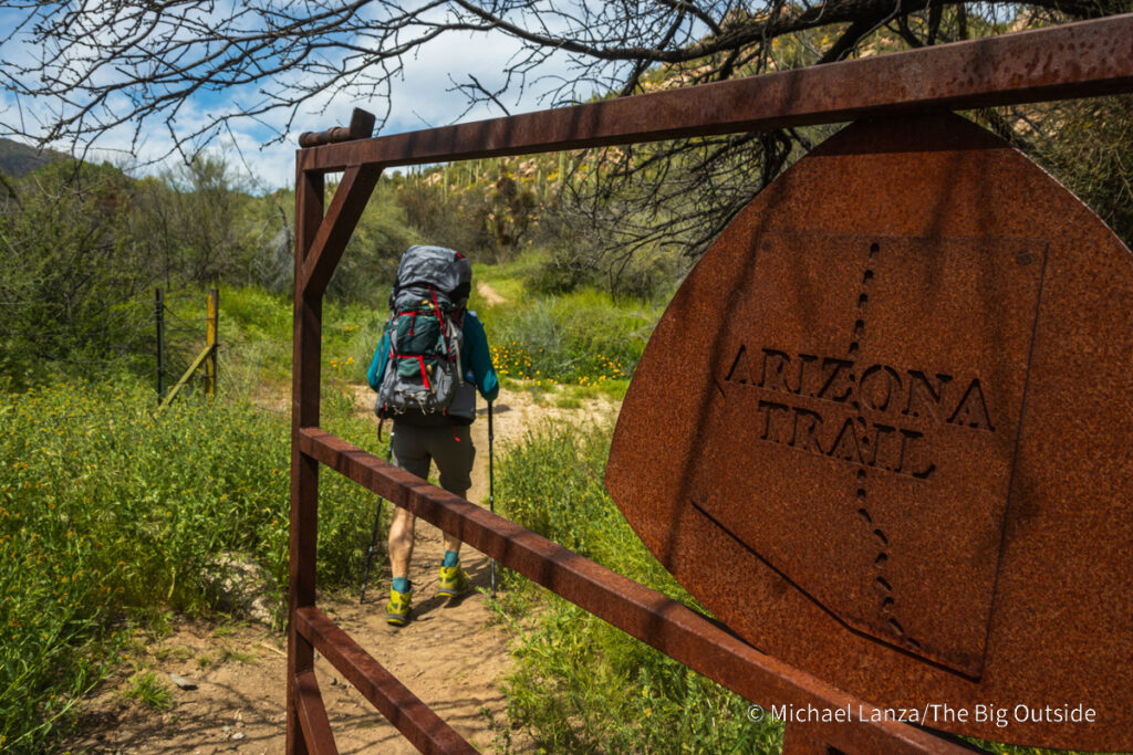 A backpacker hiking the Arizona Trail Passage 16 in the Gila River Canyon. A backpacker hiking the Arizona Trail Passage 16 in the Gila River Canyon.