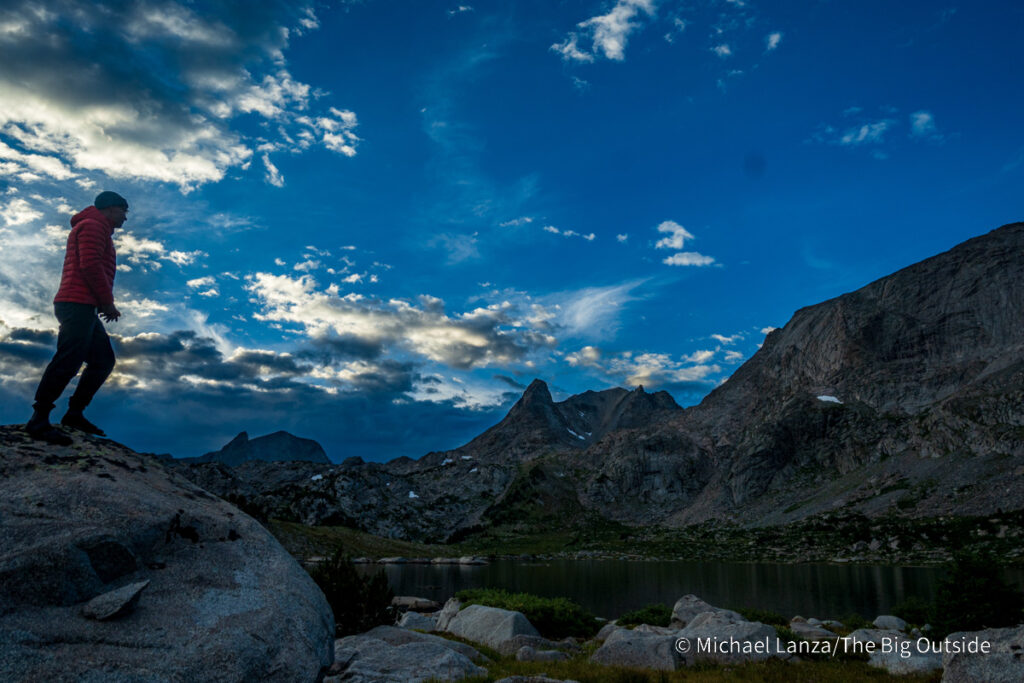 A hiker at Pyramid Lake in the Wind River Range, Wyoming. A hiker at Pyramid Lake in the Wind River Range, Wyoming.
