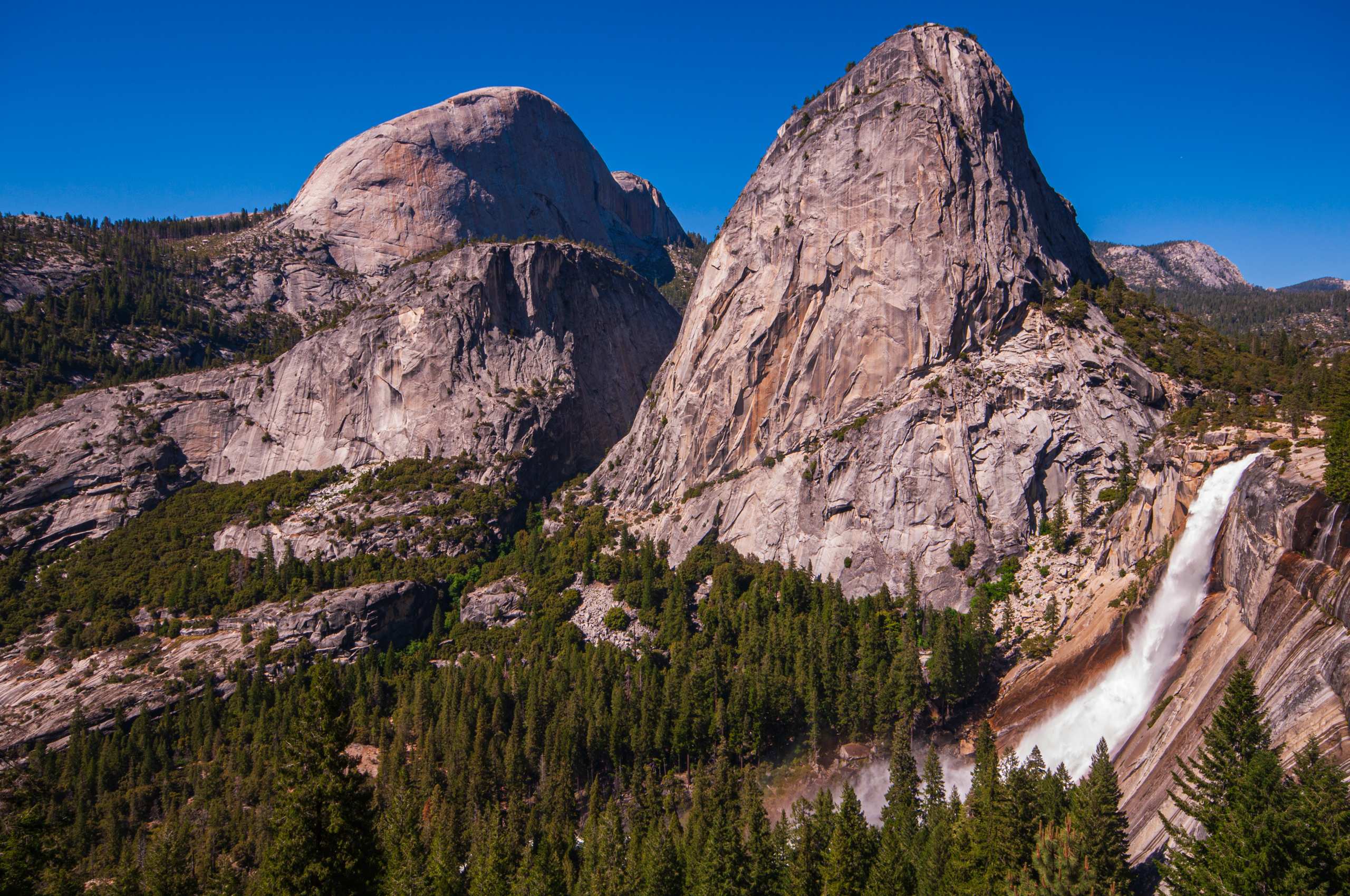 The "back side" of Half Dome, Liberty Cap, and Nevada Fall seen from the John Muir Trail in Yosemite N.P.