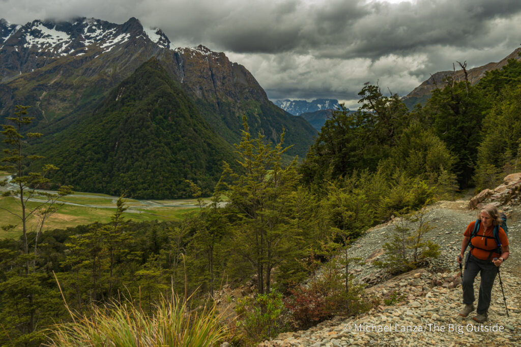 A trekker hiking the Routeburn Track in Mount Aspiring National Park, New Zealand. A trekker hiking the Routeburn Track in Mount Aspiring National Park, New Zealand.