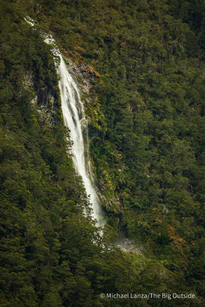 A waterfall seen from the Routeburn Flats Hut on the Routeburn Track in Mount Aspiring National Park, New Zealand. A waterfall seen from the Routeburn Flats Hut on the Routeburn Track in Mount Aspiring National Park, New Zealand.
