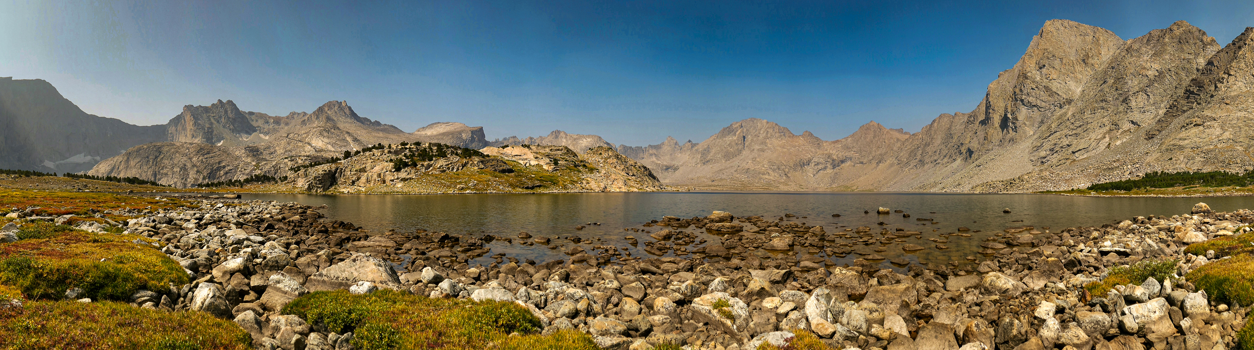 Panoramic image of Baptiste Lake and its cirque in the Wind River Range, Wyoming.